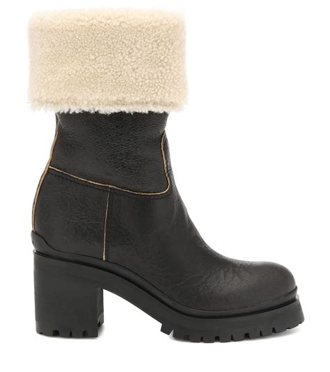 miu miu shearling trimmed boots|mini shearling boots.